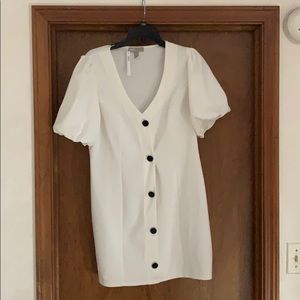 White button down dress with puff sleeves.